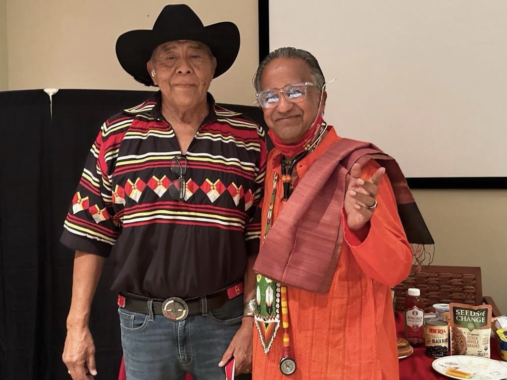 The Physician Anthropologist with a community elder during a cultural health gathering